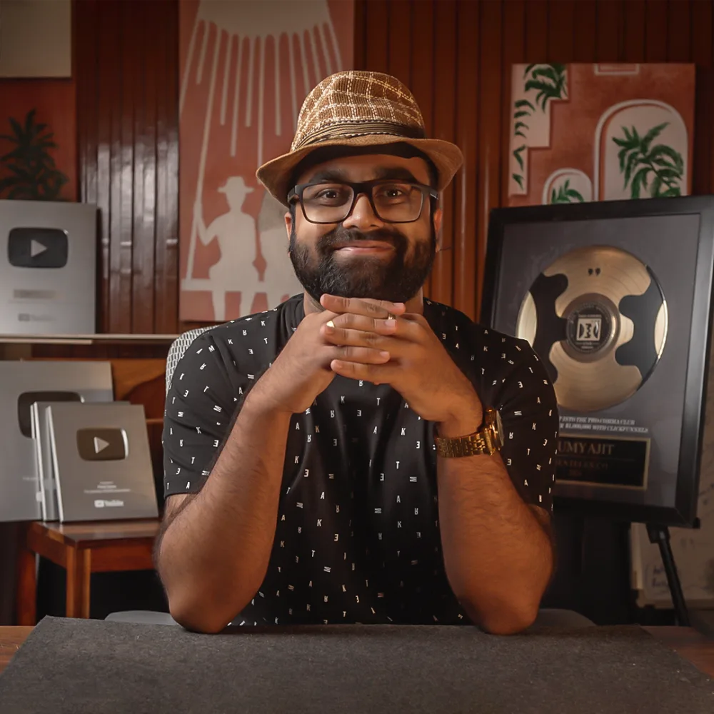 Samy, founder of ClickTheory, holding a YouTube play button award